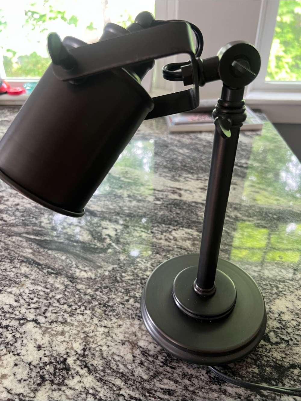 Black metal lamp with adjustable head